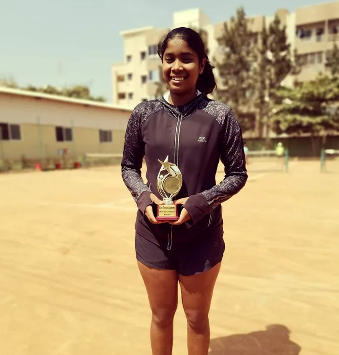 Sol Sports player with trophy